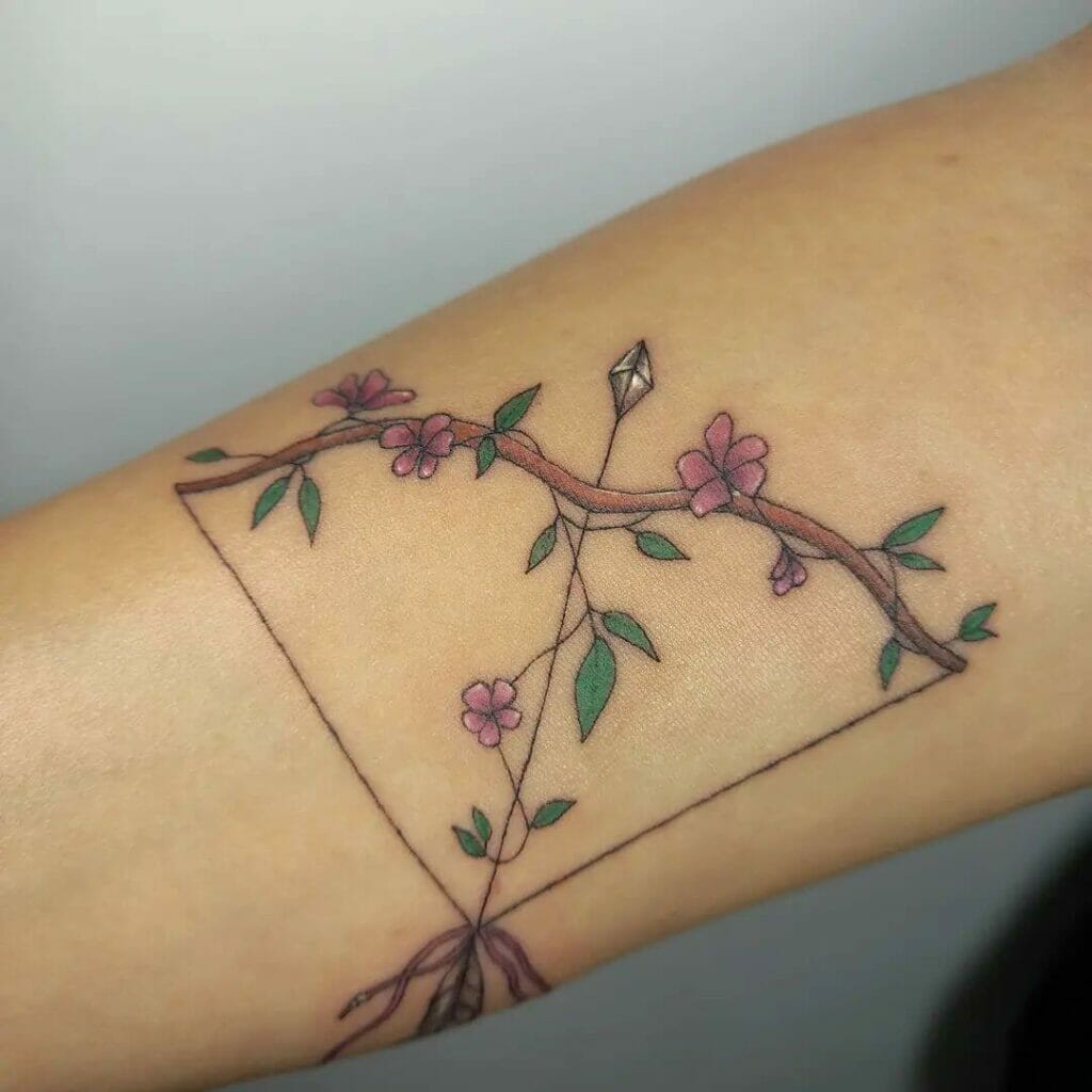 Colorful Arrow Tattoos With Flowers And Leaves Woven Into It