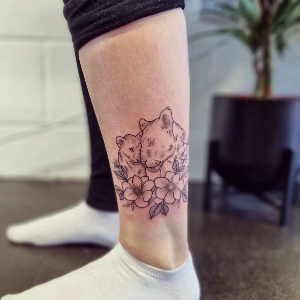 Small Lioness And Cub Tattoo Design For Leg