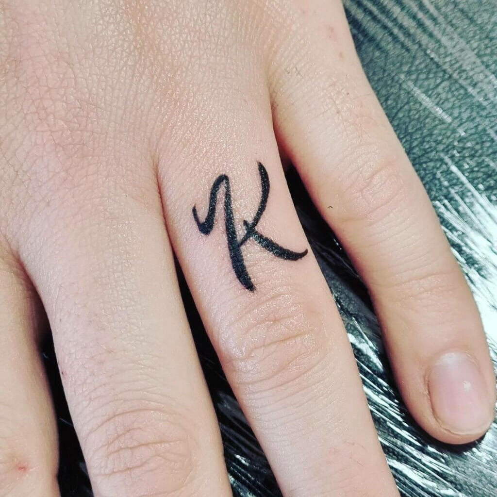 K Finger Tattoo
