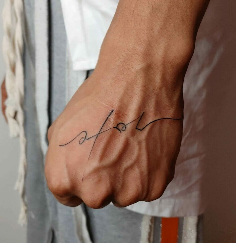 Korean Handwriting Tattoo On The Back Of The Hand