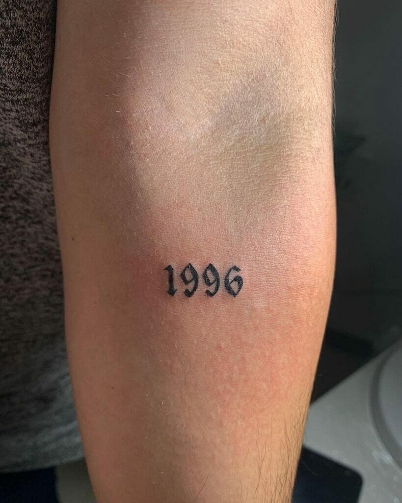 Black 1996 Elbow Tattoo