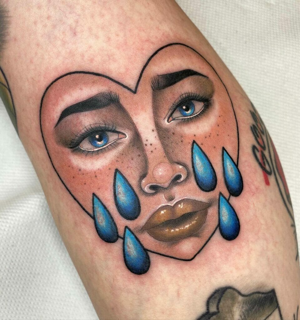 Face And Teardrop Tattoo
