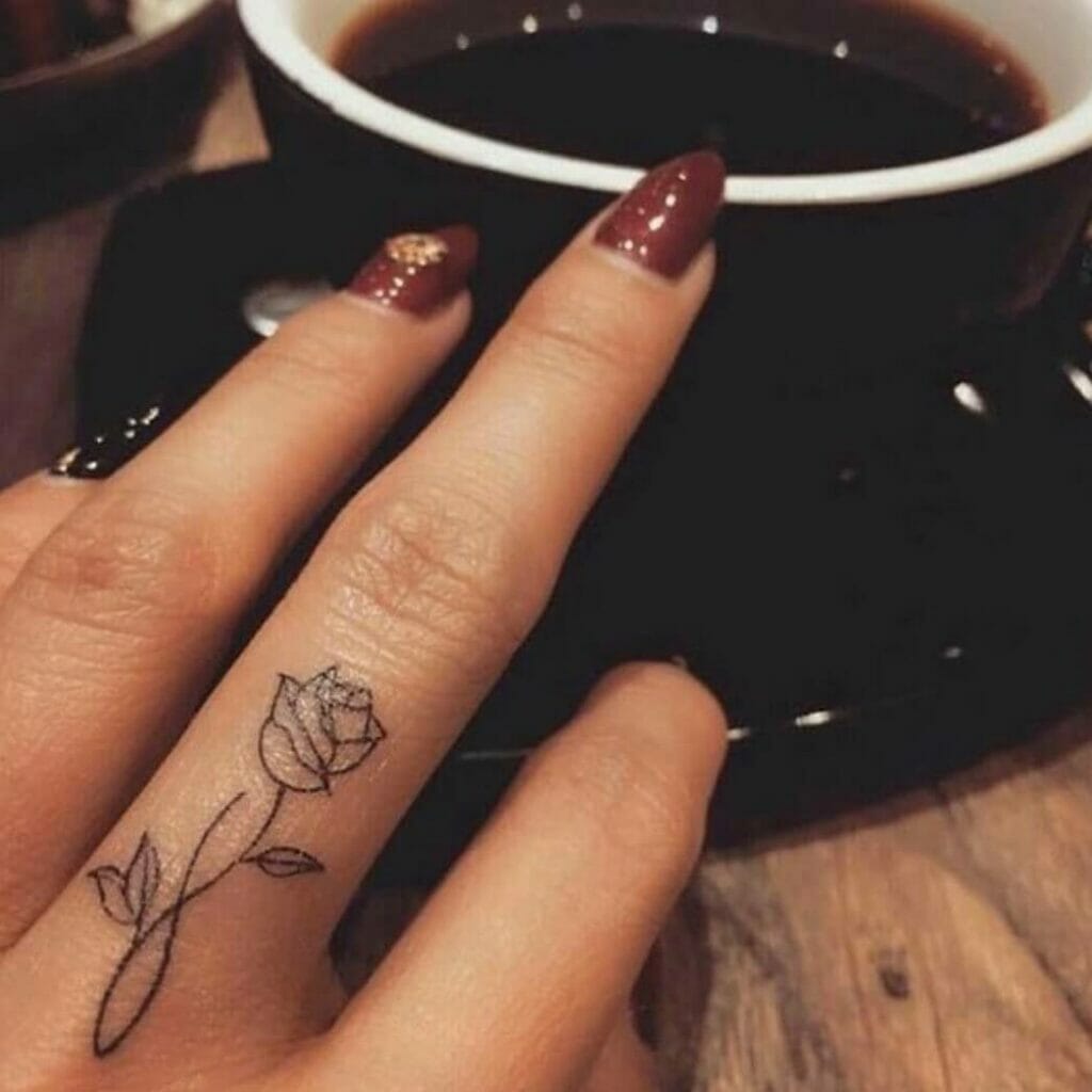 Mesmerizing And Captivating Rose Finger Tattoo