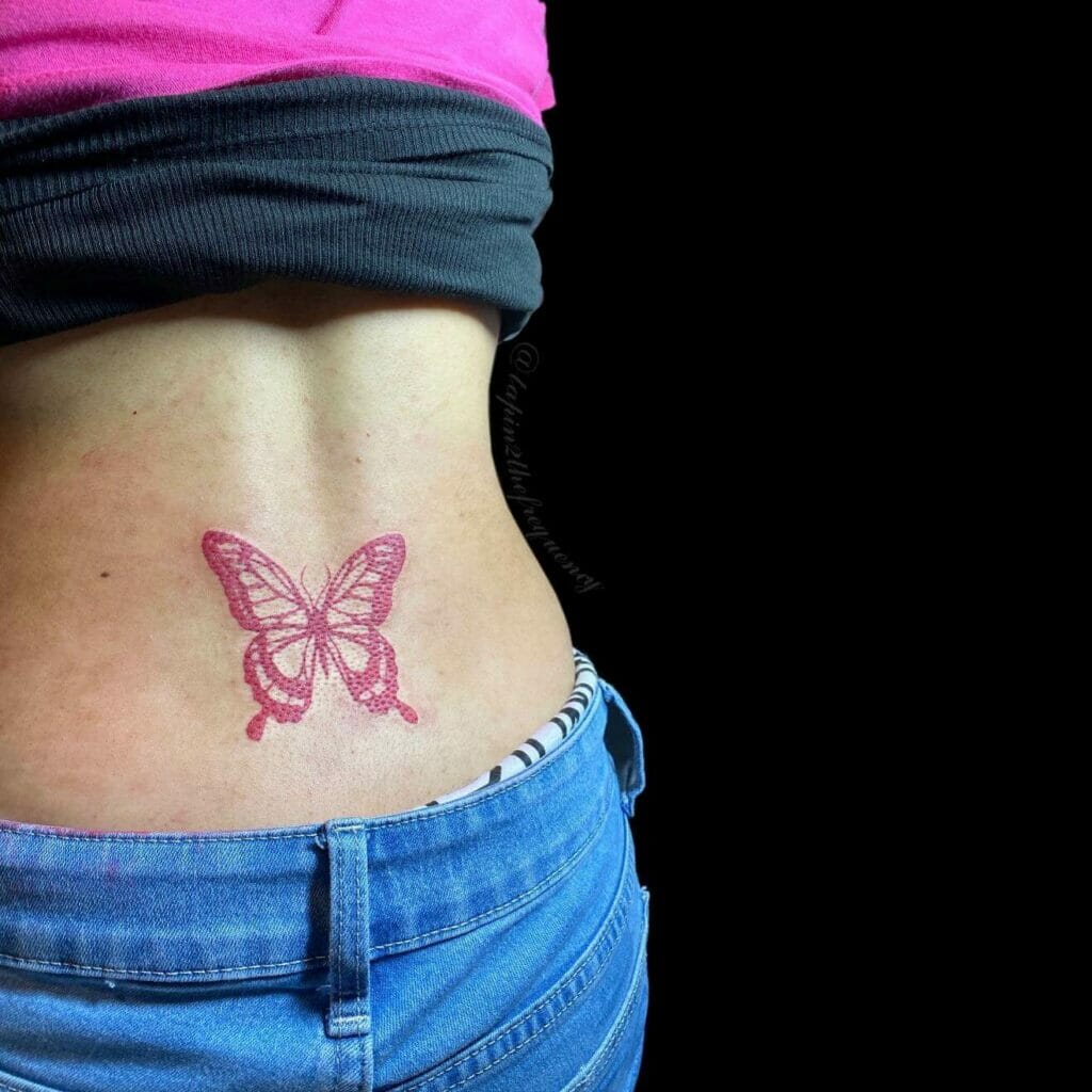 Red Ink Lower Back Butterfly Tramp Stamp Tattoo