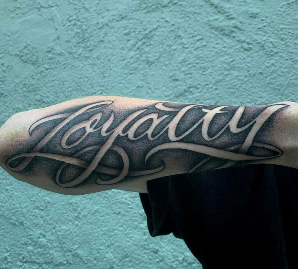 Shading Loyalty Lettering Tattoo On Arm