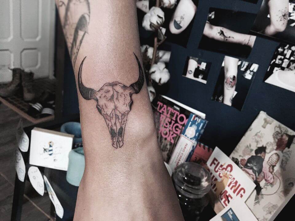 Minimalist Ox Head-bone Wrist Tattoo Design