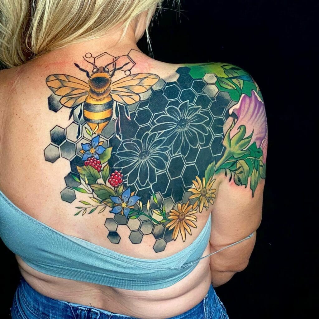 Geometric Blackout Half Back Tattoo With A Colorful Bee and Flowers