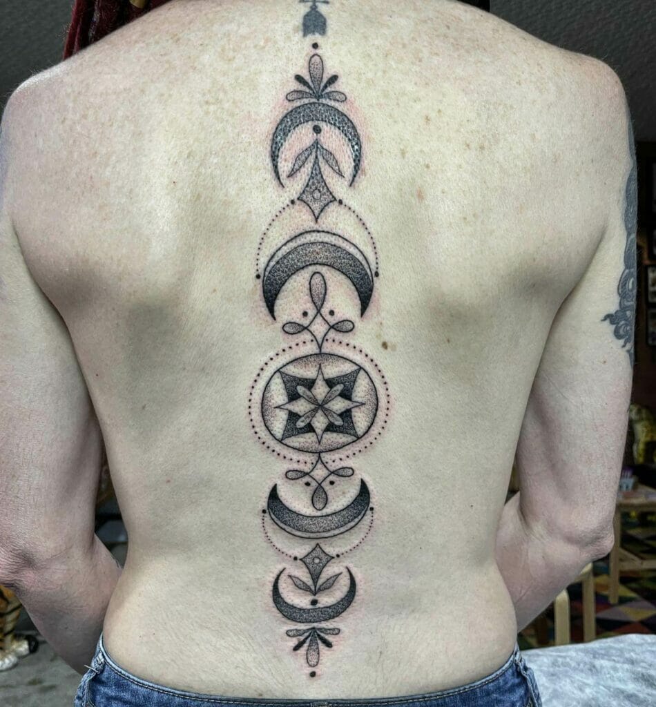 Stunning Ornamental Design Moon Tattoo On Spine