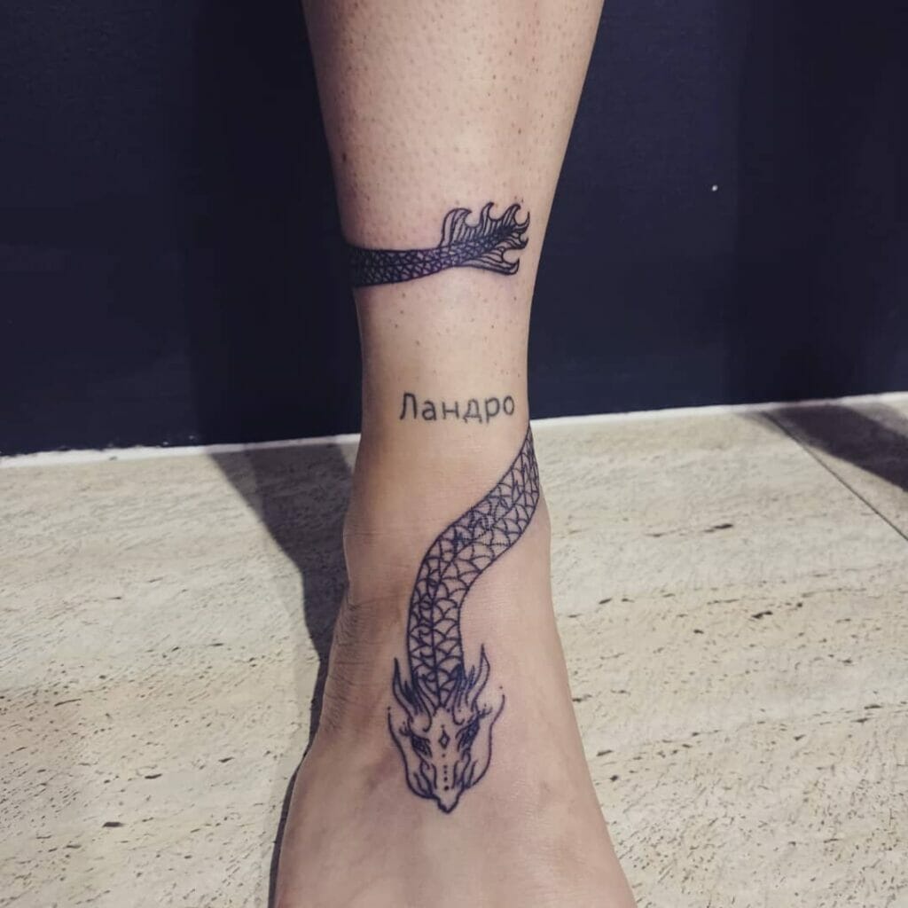 Tiny Dragon Wrap Around Leg Tattoo