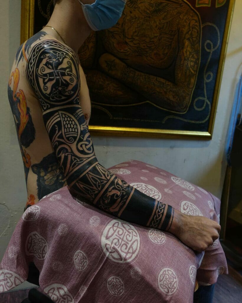 Amazing Black Ink Celtic Sleeve Tattoos