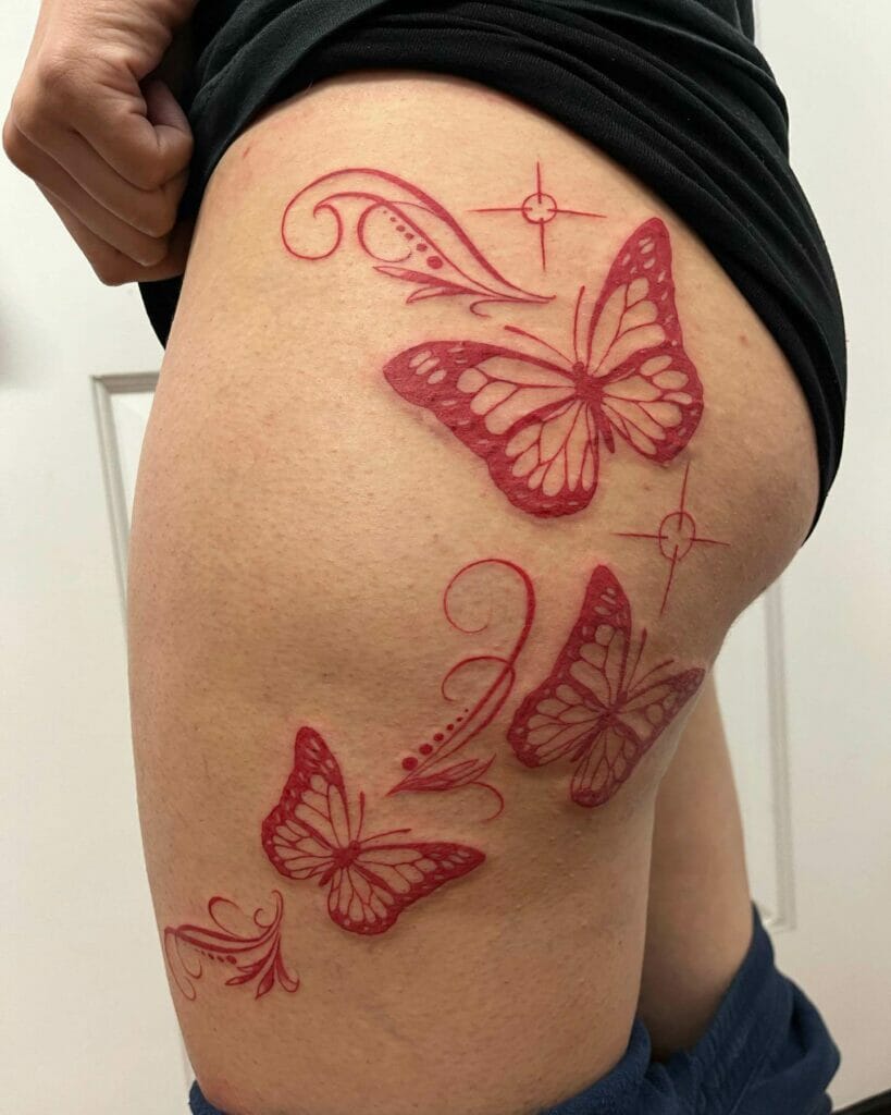 Red Butterfly Tattoo On The Upper Thigh