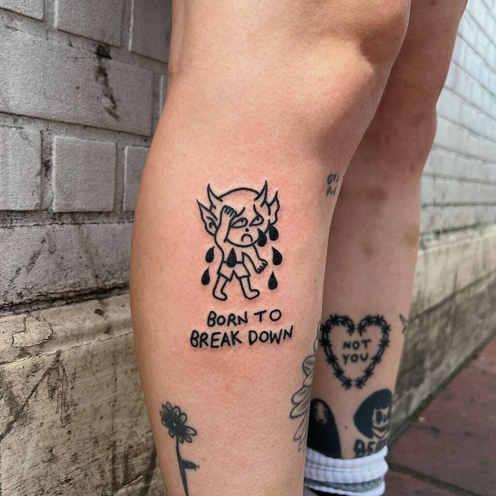 Crying Baby Devil Tattoo With A Phrase Motif