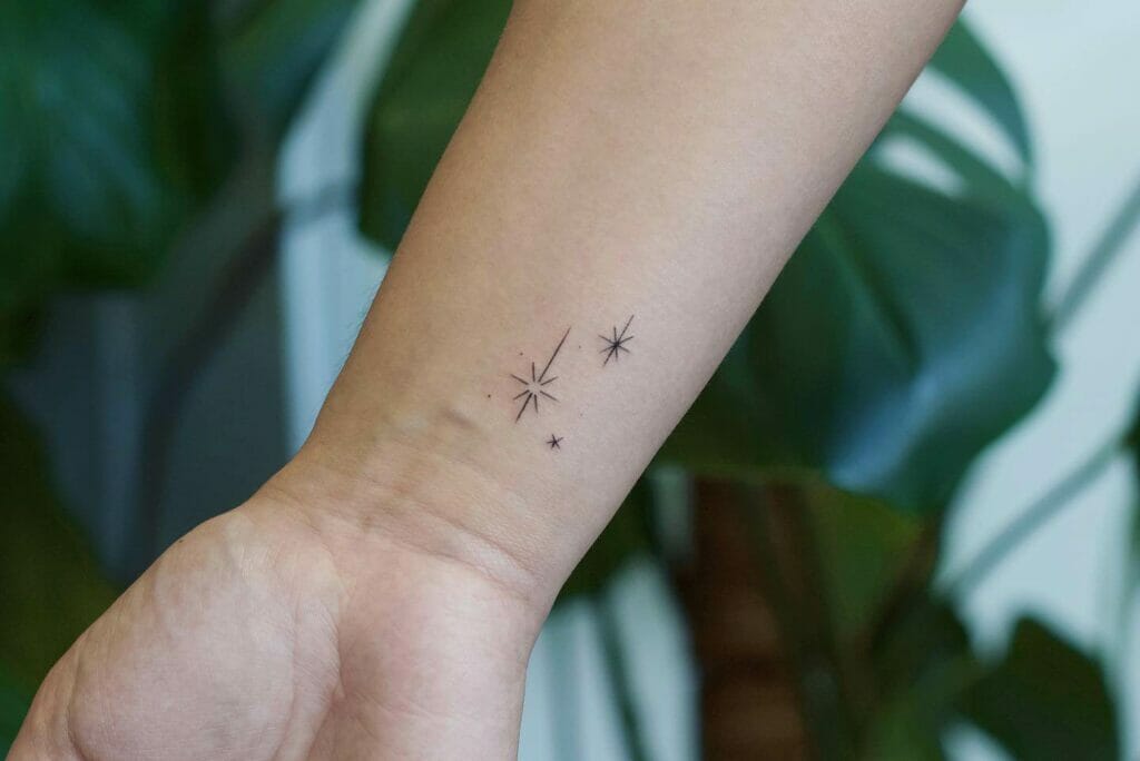 Star Tattoo Glowing Flames On Wrist