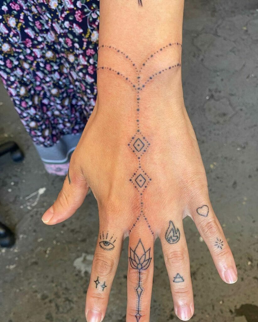 Female Arrow Finger Tattoo