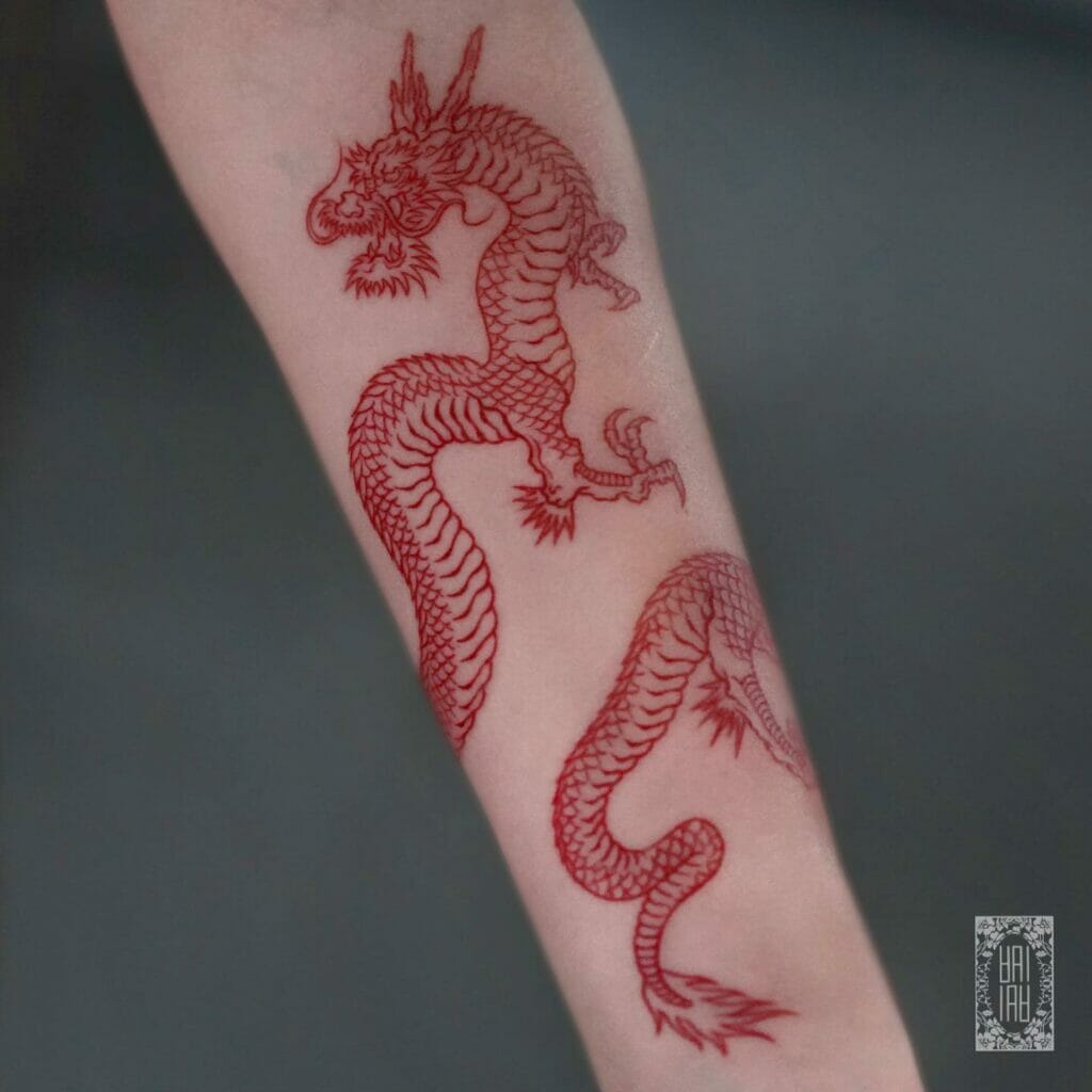 Red Ink Dragon Arm Tattoo