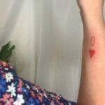 Minimalist Red Ink Tattoo