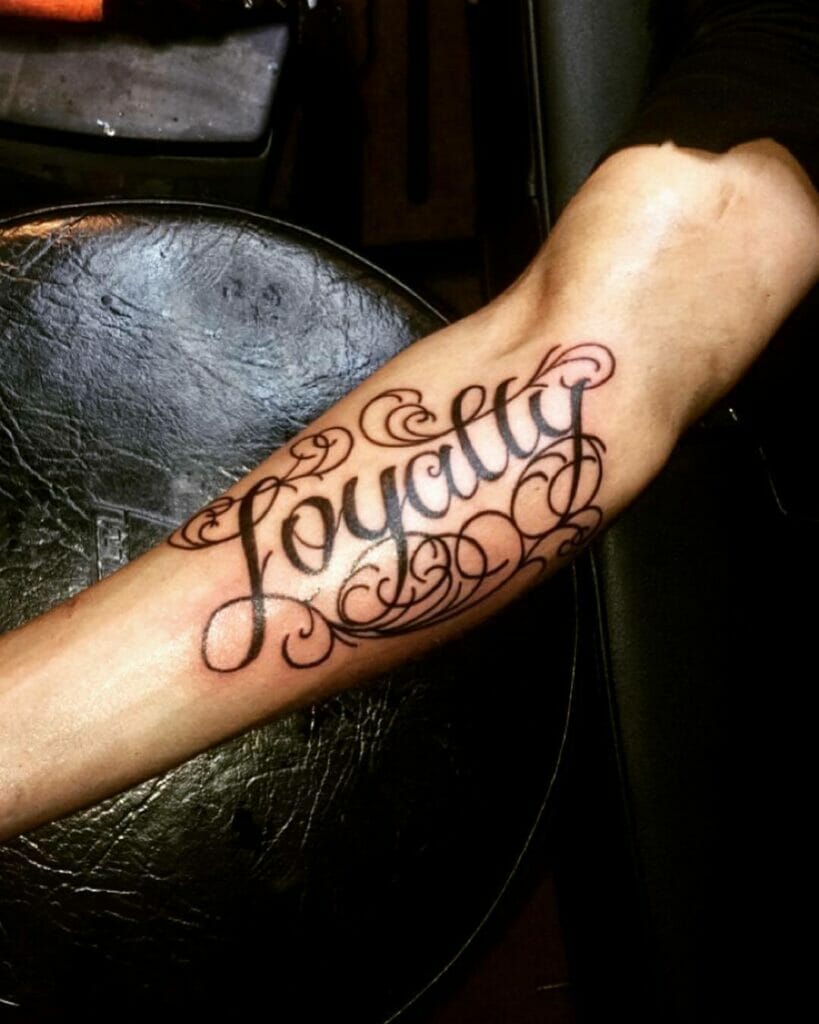 Black Ink Loyalty Tattoo On Arm