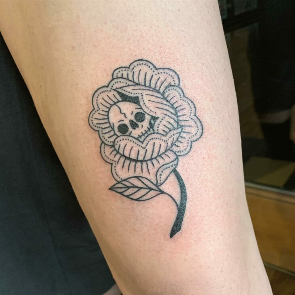 American Traditional Skull And Flower Tattoo