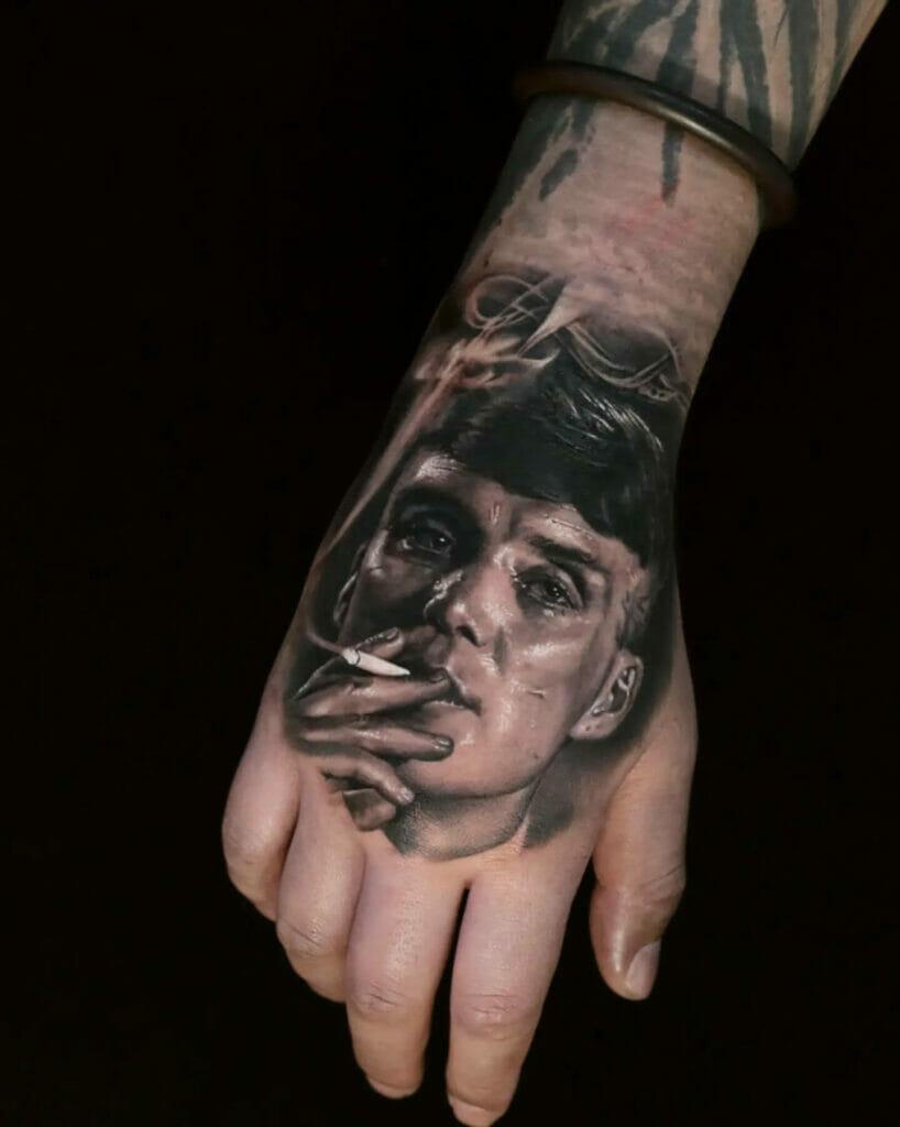Microrealistic Tommy Shelby tattoo on the inner arm