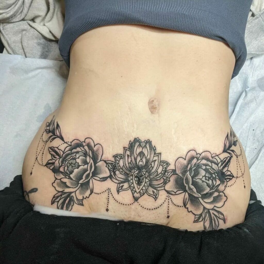 Floral Belt C Section Scars Tattoo Design