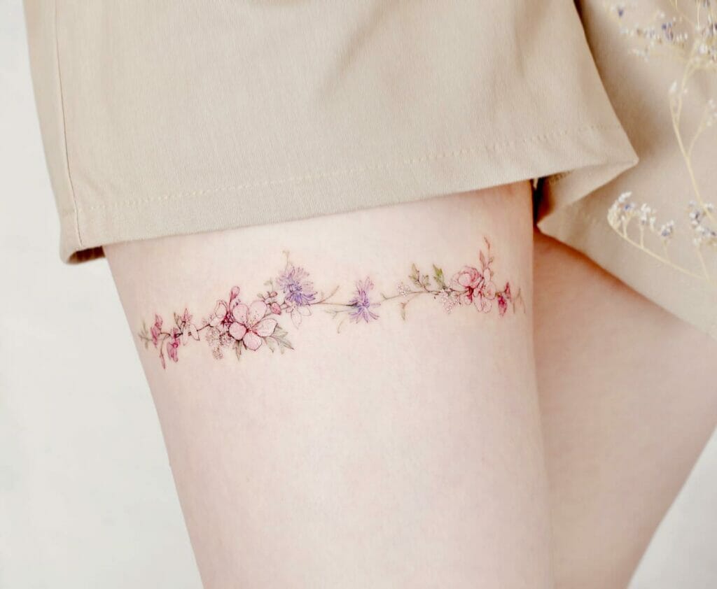 Delicate Flowers Colourful Band Thigh Tattoo