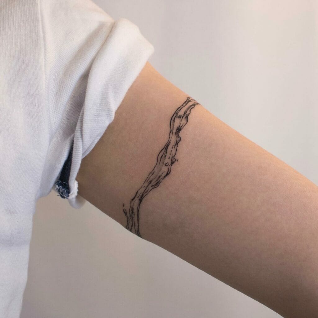Female Bicep Armband Tattoo