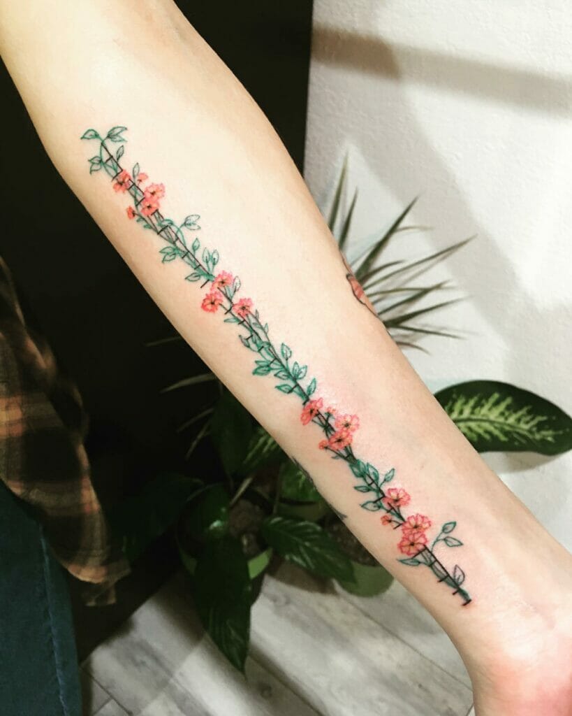 Flowers Intertwined With Ruler Tattoo