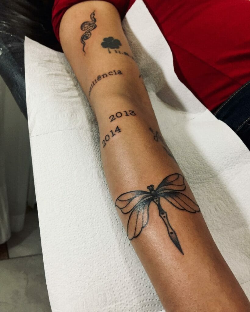 Right-Hand Dark Ink Long Dragonfly Tattoo Design