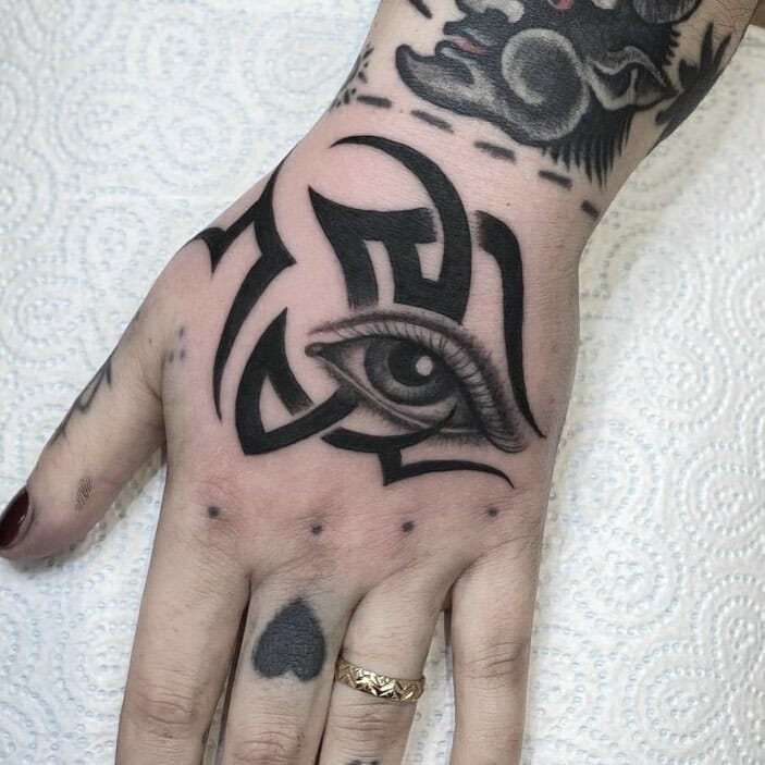 Traditional All-seeing Eye Tattoo Alongside Some Majestic Tribal Designs