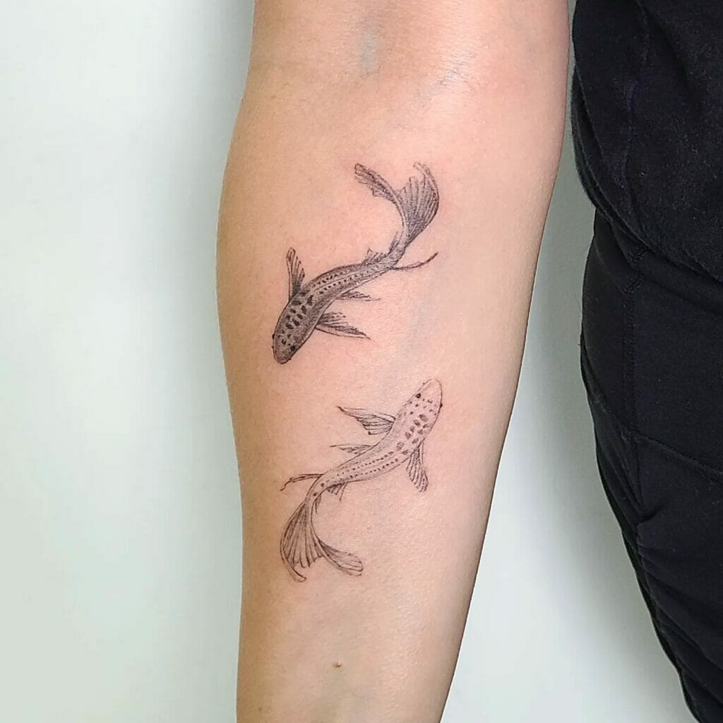Two Koi Fish Tattoos On The Forearm