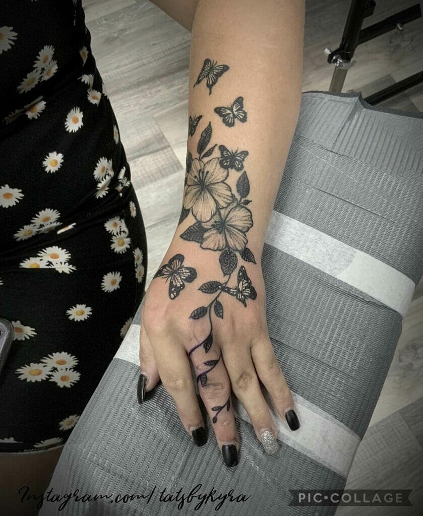 Elegant Vine Finger Tattoo With Floral Motifs