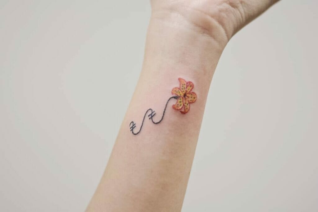 Small Hand Poke Tiger Lily Tattoo