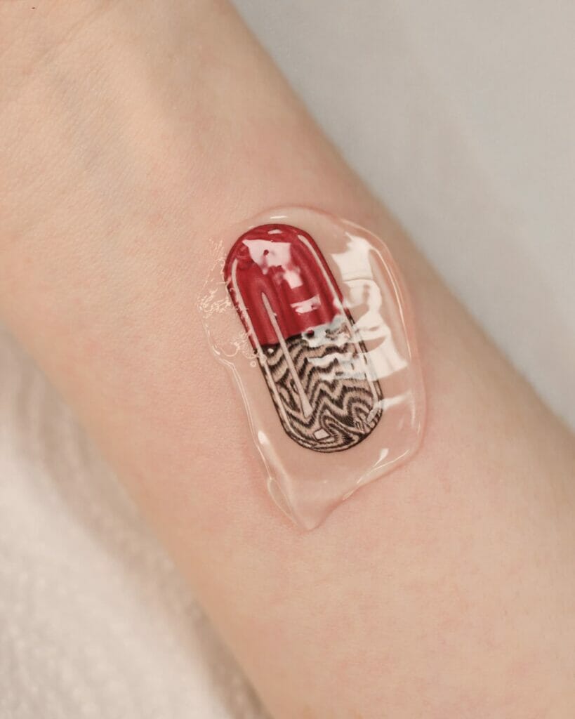 Trippy Monochromatic And Red Pill Tattoo