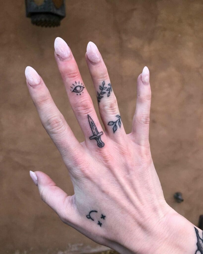 Evil Eye Finger Ornament Tattoo