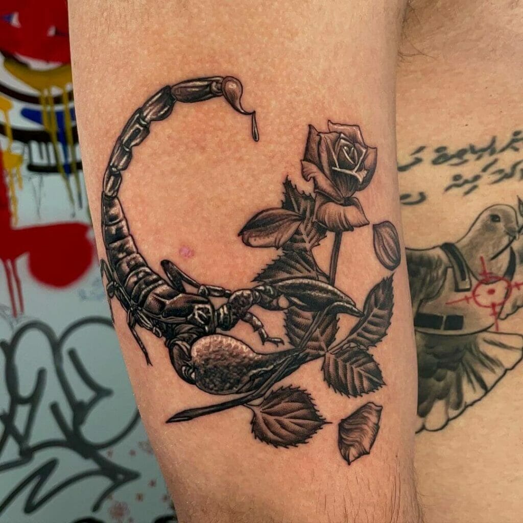 Scorpion Holding Rose Tattoo