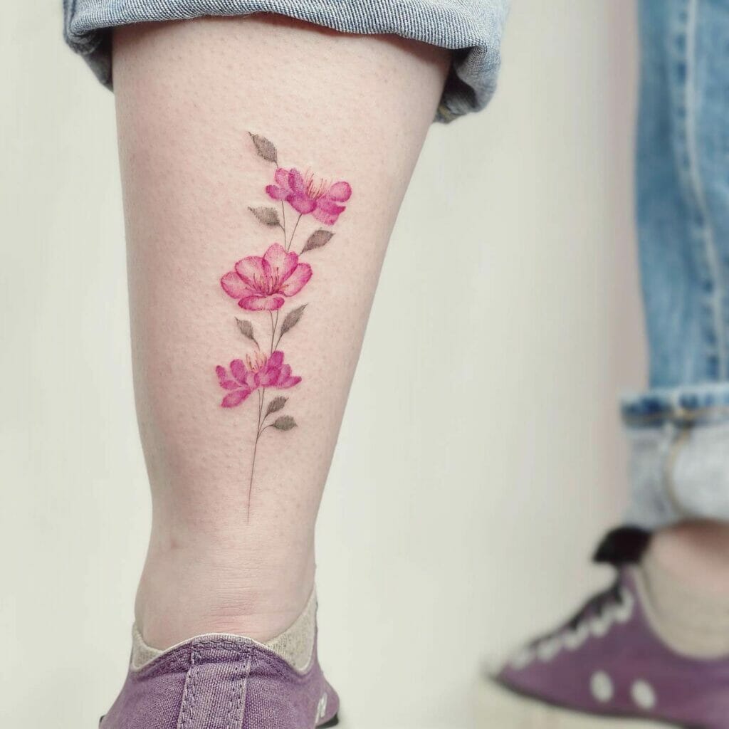Pink Flower Tattoo Above The Knee