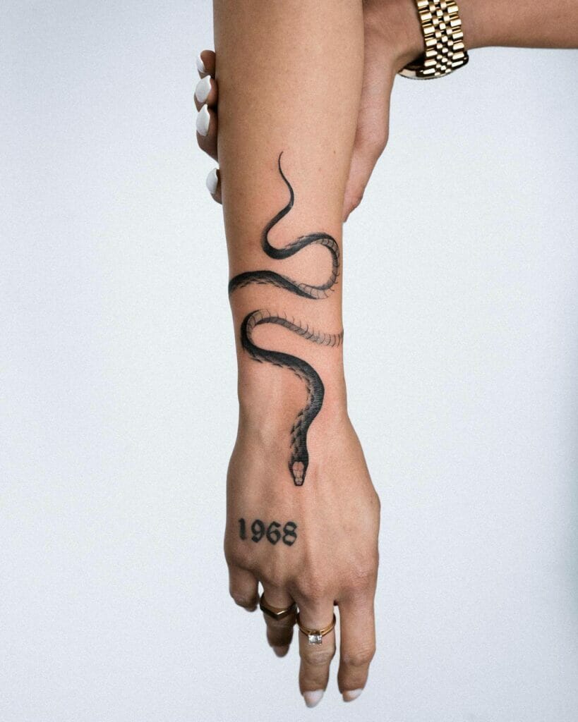 Black and White Snake Tattoo on Forearm