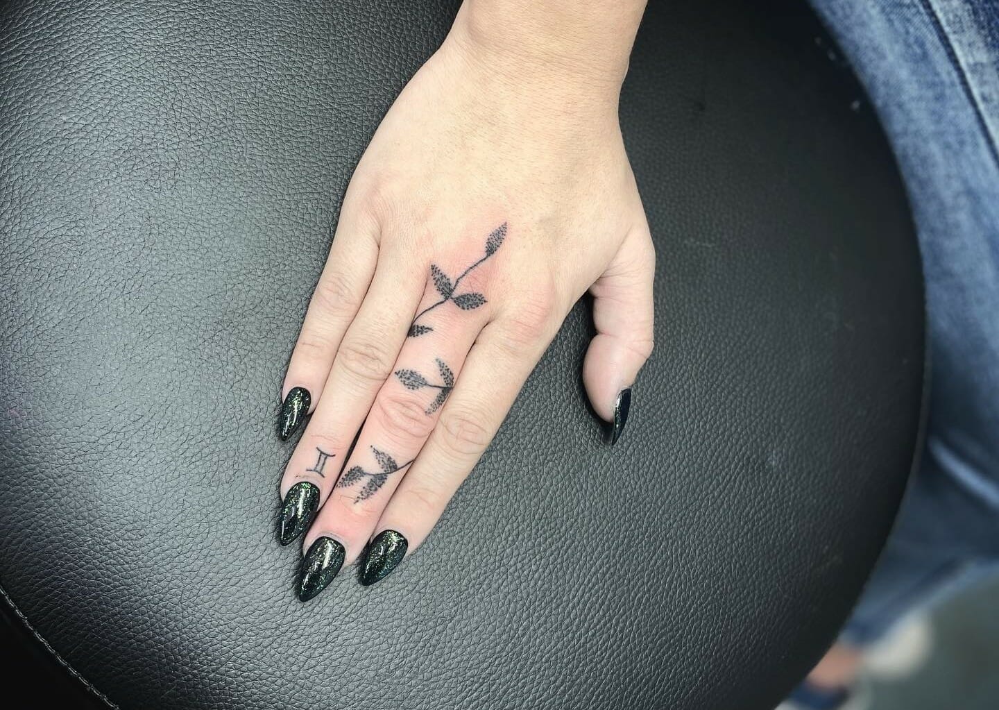 Wedding ring tattoo IDEA incorporate husbands initialsname as base of  tendrils  Ring finger tattoos Wedding band tattoo Ring tattoos