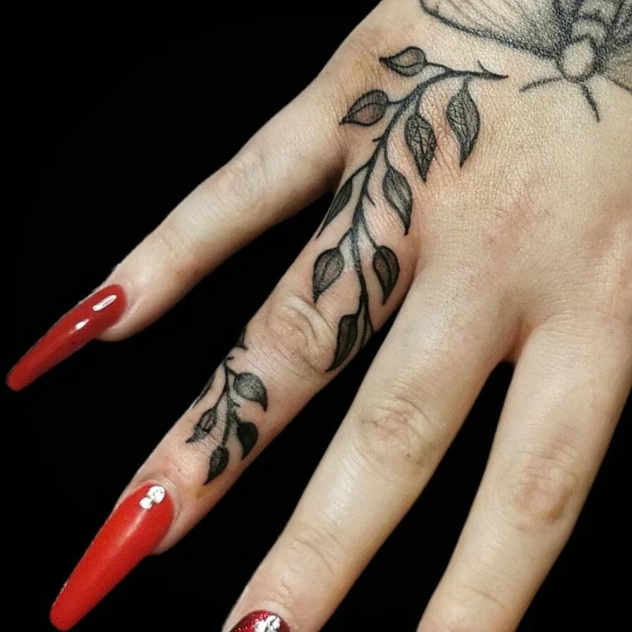 Vine Finger Tattoo With A Bee
