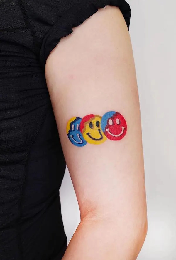 Smiley faces upper arm tattoo by zoonmo .jpg Outsons