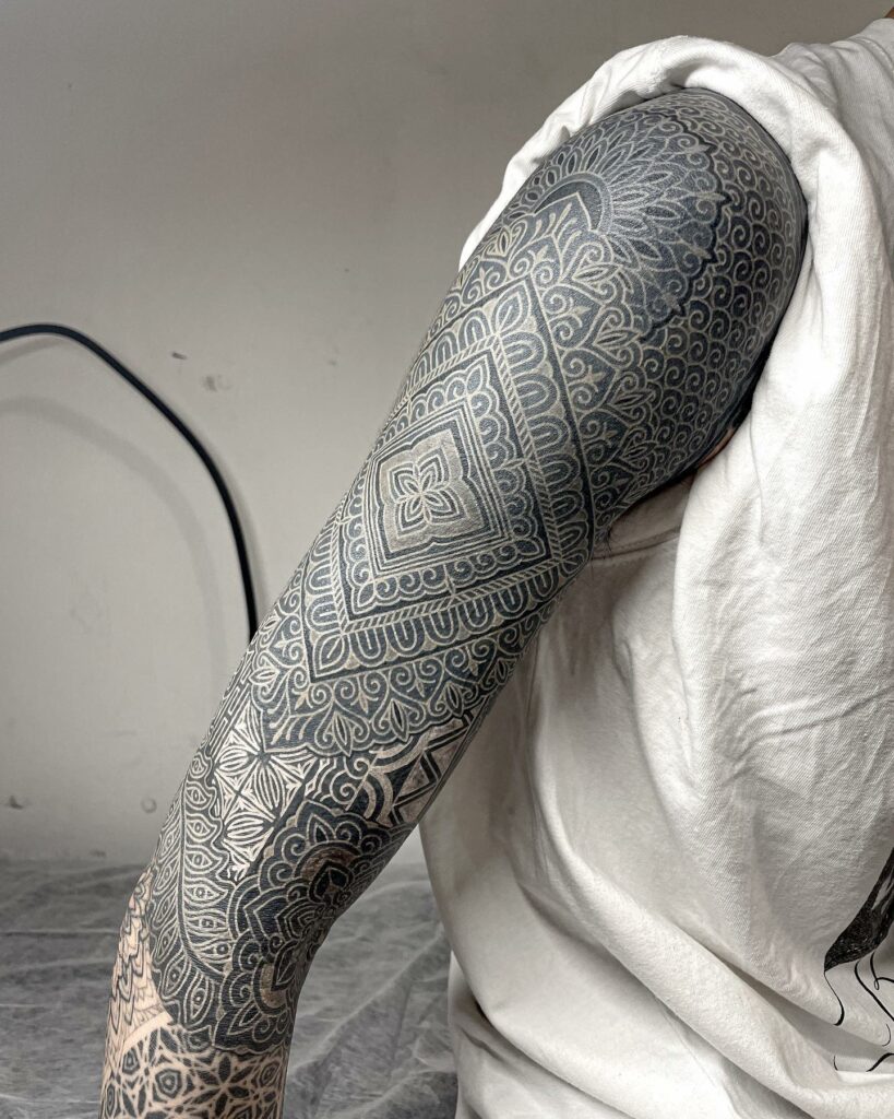 Geometric white ink tattoo