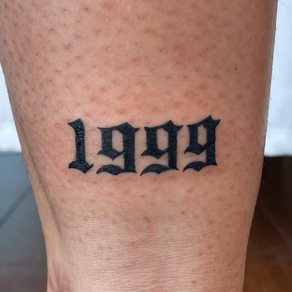 1999 Script Tattoo on Thigh