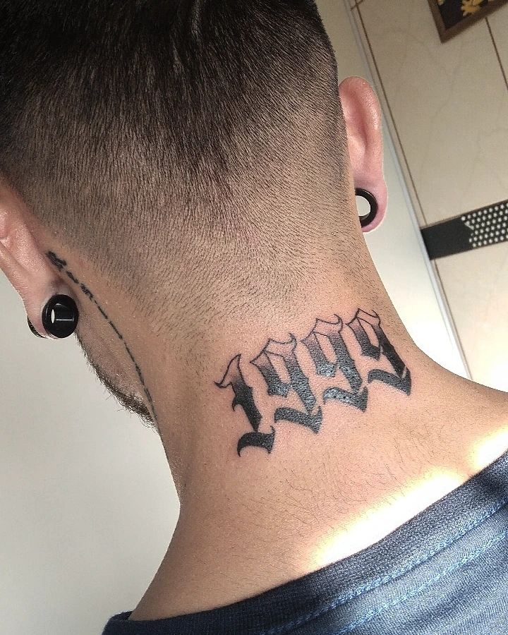 1999 Sign Tattoo on Neck