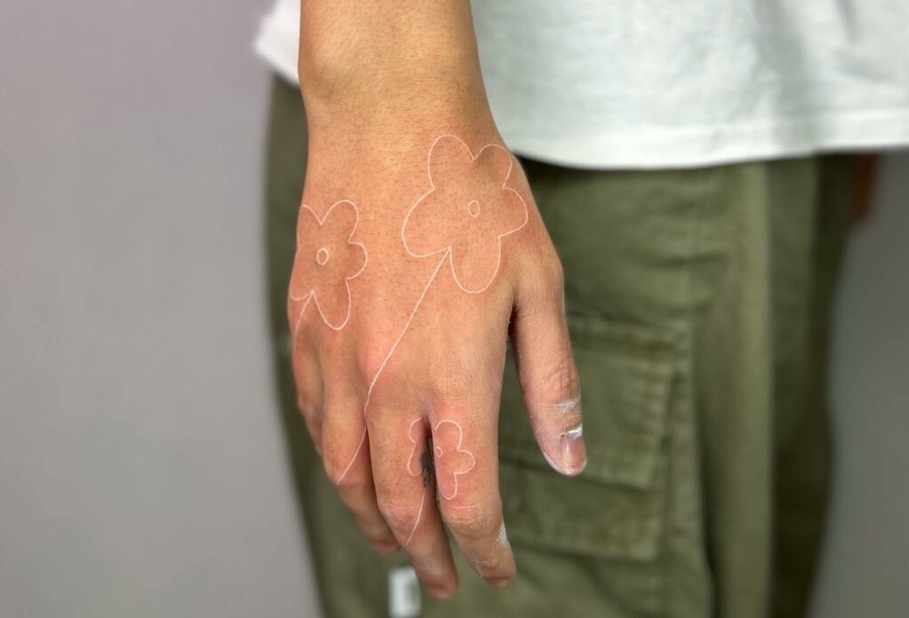 White Ink Finger Tattoo