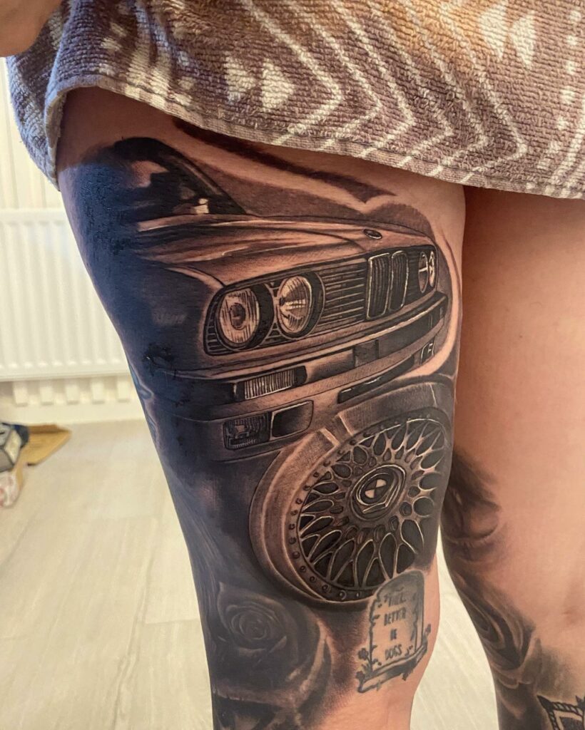 Black and Grey Alien BMW Car Tattoo On The Leg
