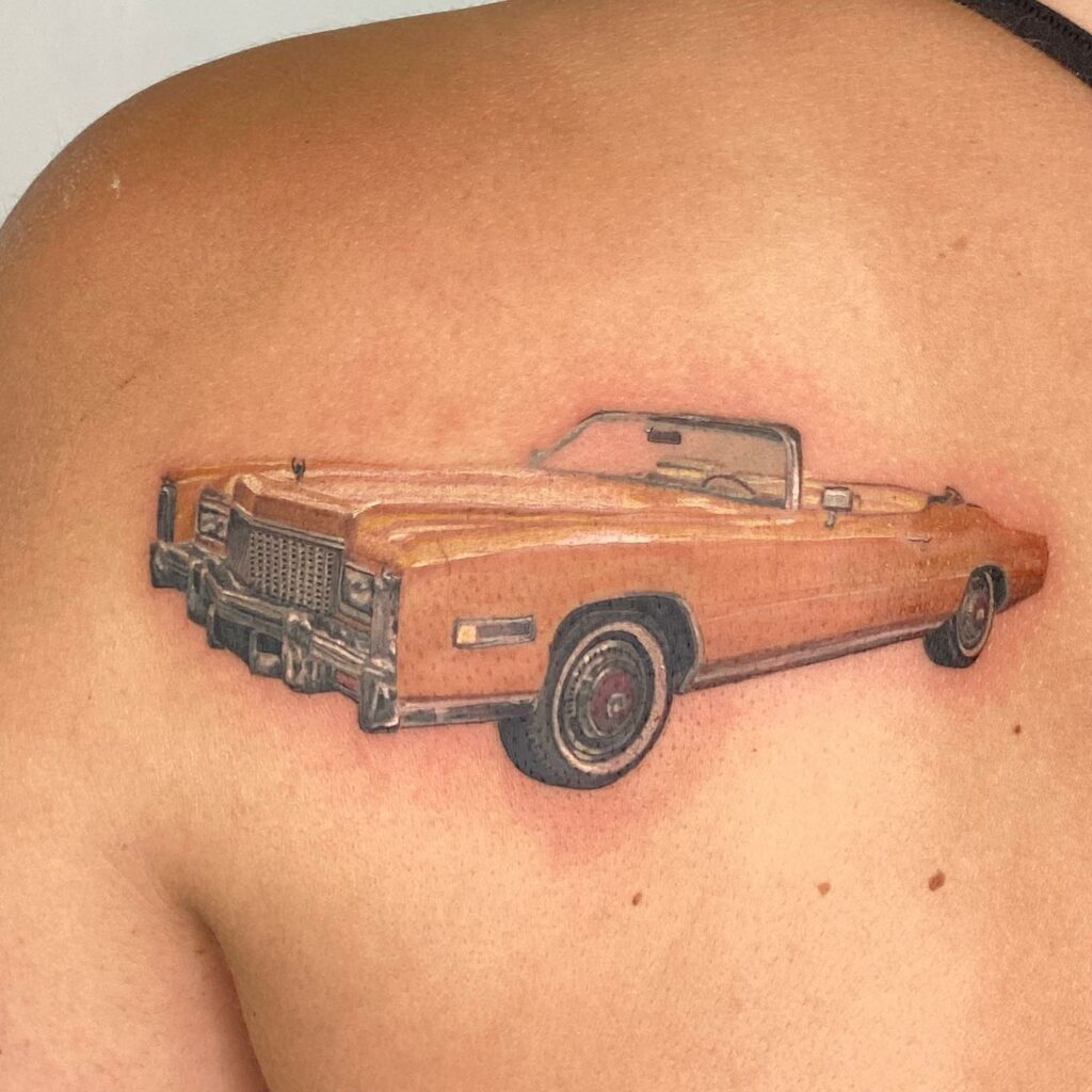 Blue Cadillac Car Tattoo On The Back