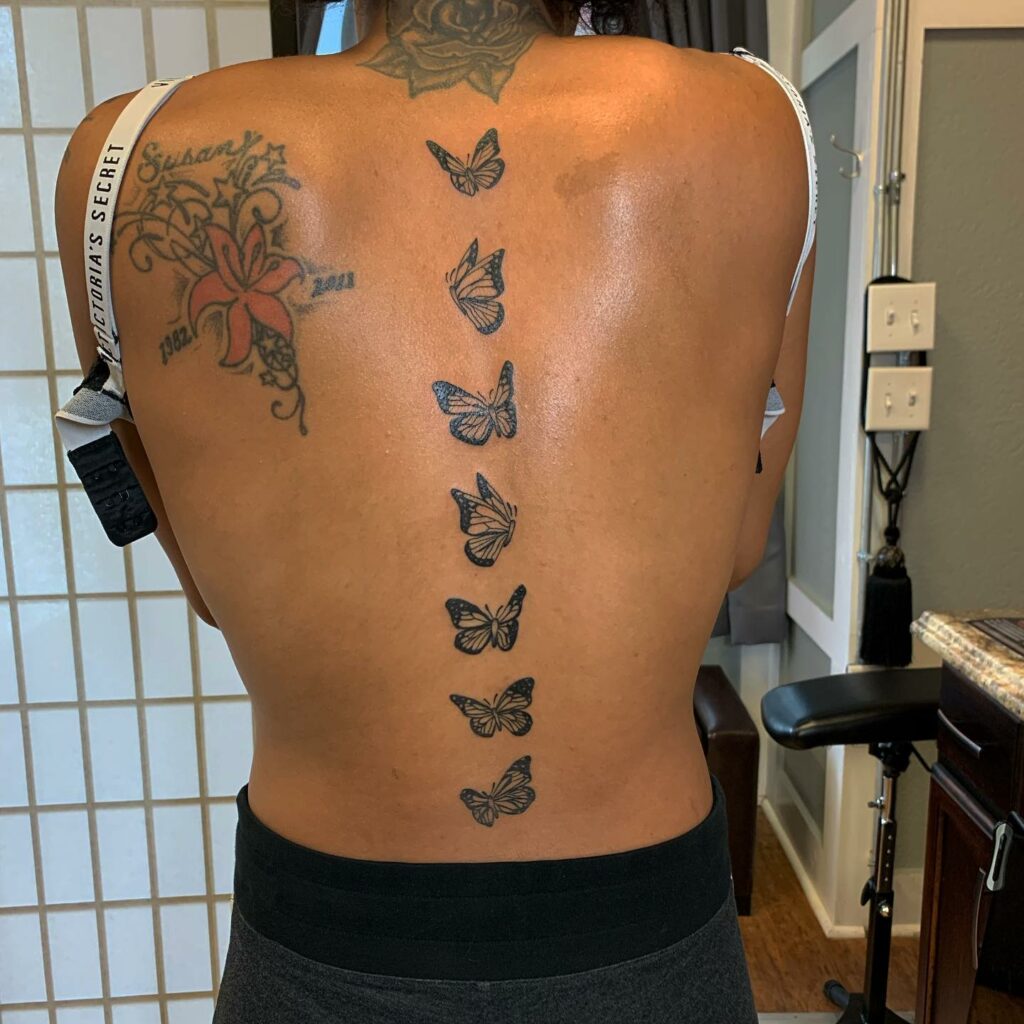 Butterfly lower back tattoo