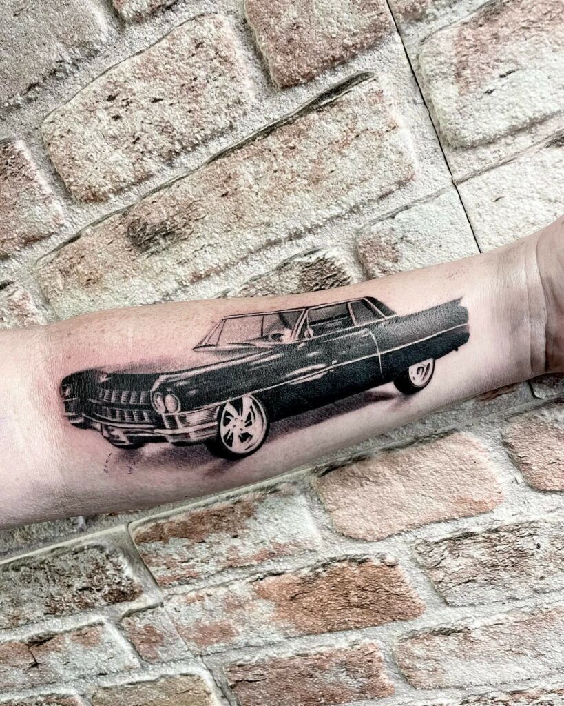 Cadillac Black And Grey Tattoo On The Forearm