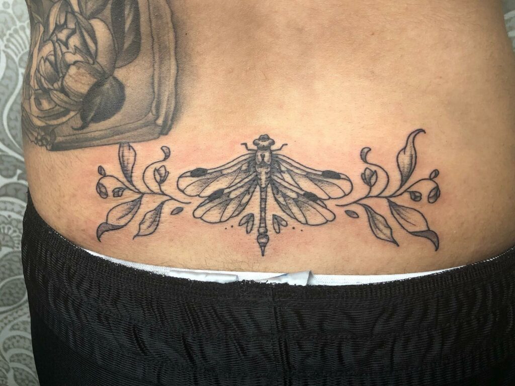 Dragonfly lower back tattoo