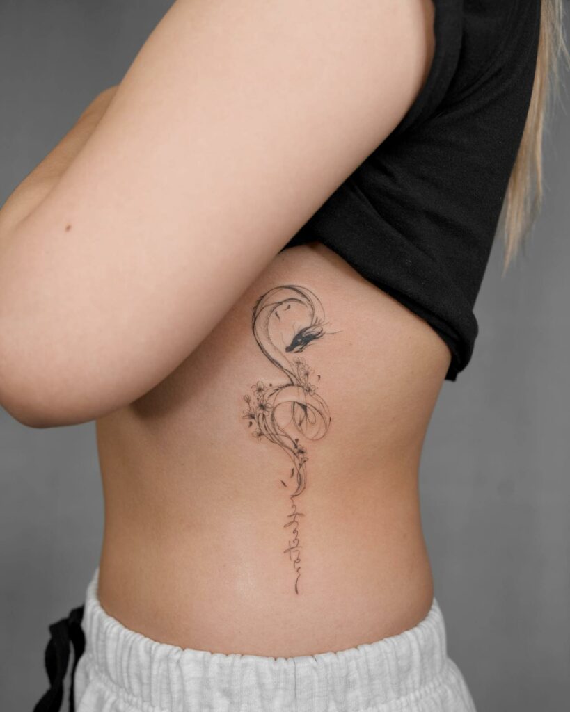 Light gray dragon rib tattoo